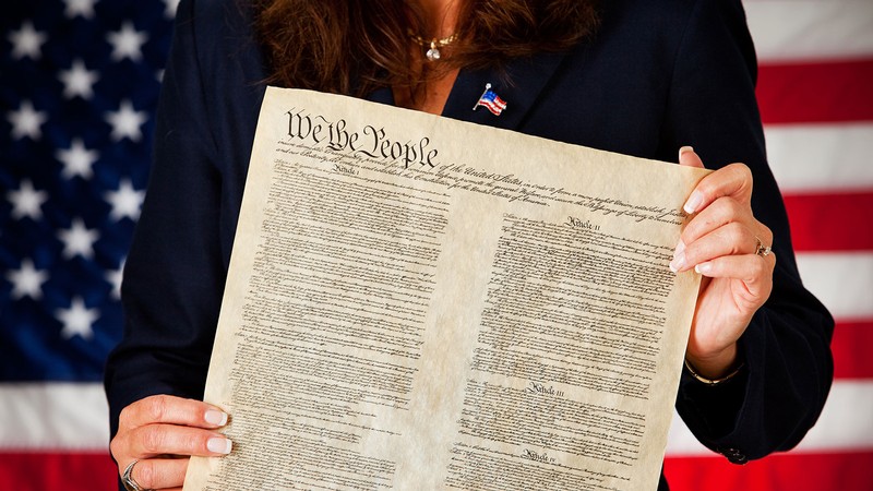Woman holding the U.S. Constitution