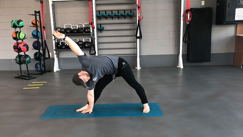 trainer doing a workout move.