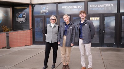 Three people pose for a photo