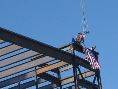 Construction workers atop USU Life Sciences Building