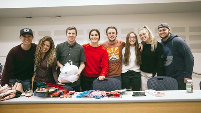 Students holding Christmas presents.