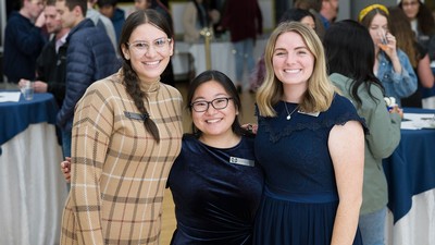 Three women at a banquet.