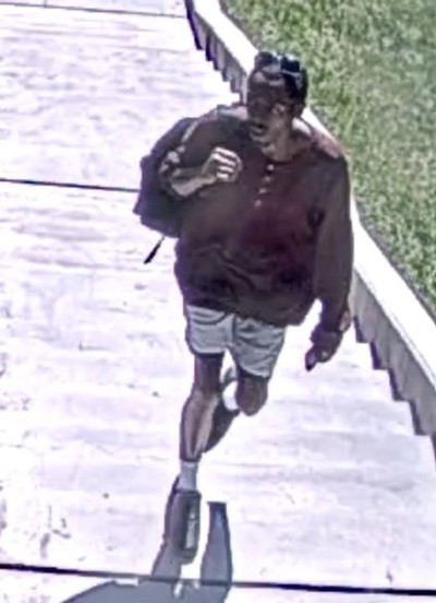 A man is seen on surveillance footage.