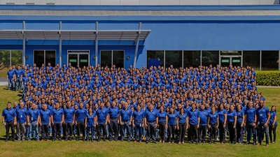 Hundreds of employees pose for a photograph in Costa Rica.