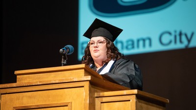 Elise Woolstenhulme speaks during the USU Brigham City graduation ceremony.