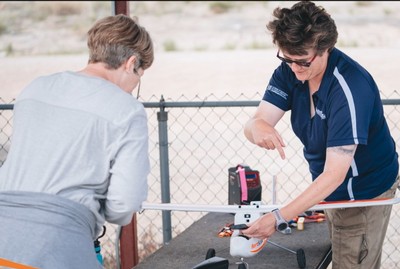 Shalyn Drake with a small drone aircraft.