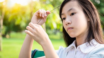 A person pulling her hair.