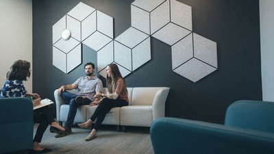 A therapist talks with clients.