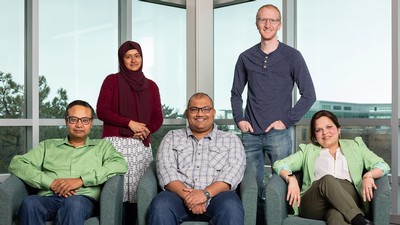 People pose for a photograph.