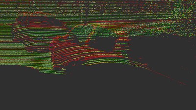 Red, yellow and green dots on a black background show the contours of cars.