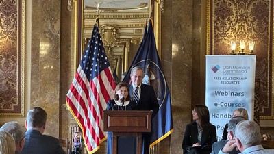 Mike and Jackie Leavitt speak in the Utah State Capitol building.