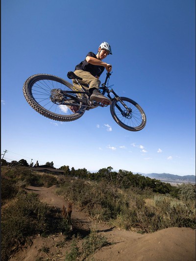 A mountain biker in midair.
