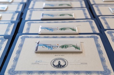 Award certificates with chocolate bars.