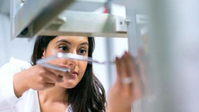 An employee performs a task at work.