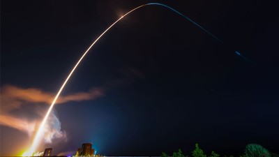 A rocket trail in a long-exposure composite photo.