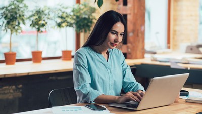 A worker at a laptop.