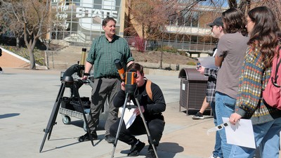 People using solar telescopes