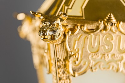 A closeup of the golden bulls and beehives on USU's new ceremonial mace.