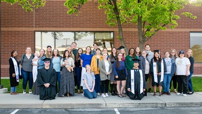 A group of graduates pose for a photo