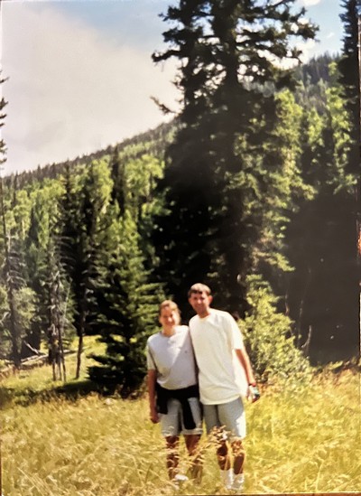 Jeff and Jackie Davis standing in a forest.