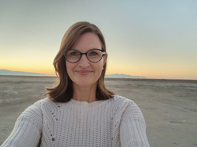 Amy Reid standing on a dry lakebed.