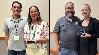People receiving awards at a ceremony.