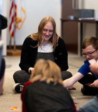 Sarah Weese speaking with people in a classroom.