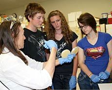 high school students and USU faculty member in Biotechnology Summer Academy lab