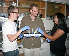 high school students and USU faculty member in lab