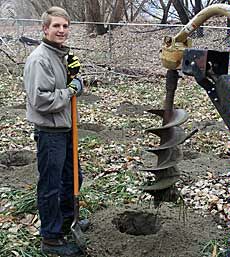 Utah 4-H member Dallin Bunnell preparing to plant trees