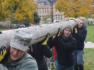 AFROTC students lifting logs