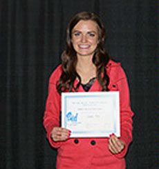 USU student Leann Fox with scholarship check