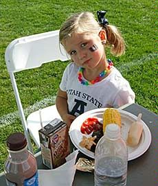 a young child at the Utah Agricultural Products BBQ at USU