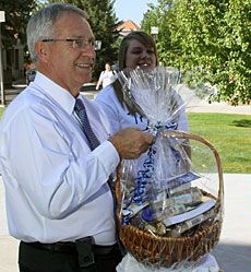 USU President Stan Albrecht with College of Ag gift basket