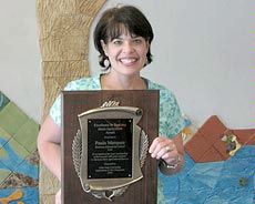 Paula Marquez with her teaching award