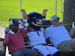 USU alums and Big Blue take a break at the Alumni Golf Tournament