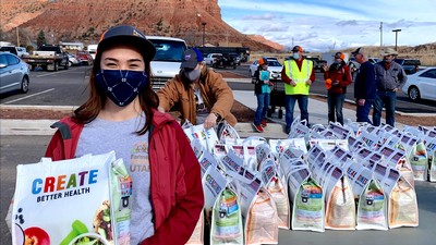 Amria Farnsworth distributing food last year at a Farmers Feeding Utah event in Southern Utah.