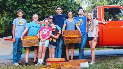 Amria working with volunteers who picked excess produce at locations around Cache Valley.