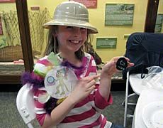 a young visitor at USU's Museum of Anthropology