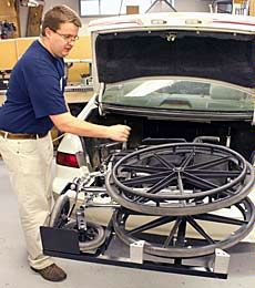 USU student designer with wheelchair lift
