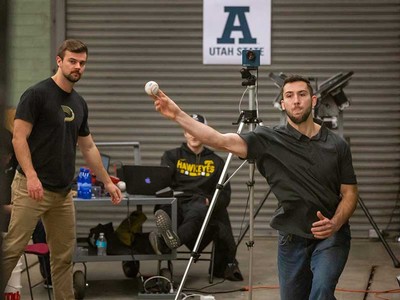 Pitching trainer Dean Jackson throwing a baseball