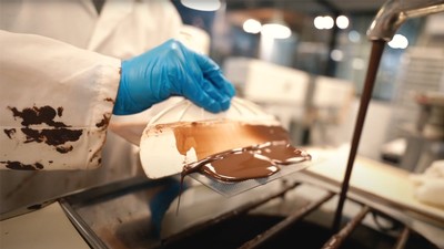 Students producing the chocolate and custom molds.