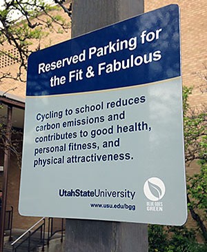 a bike reserved parking sign on USU's campus
