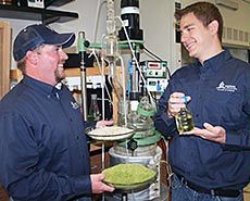 USU studentMike Morgan and doctoral student Alex McCurdy in a USU lab