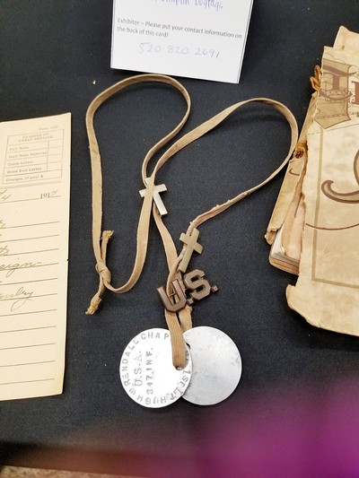 Dog tags are displayed in a Bringing War Home pop-up exhibit.
