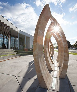 A sculpture located outside the new building