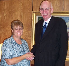 Jeanie Peck is congratulated by Sen. Bob Bennett