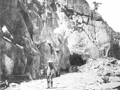 Chinese worker hauling a bucket