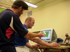 Graduate student Mike Capell (in cap) directs the animated short.