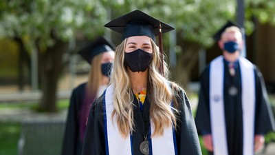 USU 2021 graduate in cap and gown.